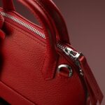 Closeup shot of a luxury red leather bag Closeup shot of a luxury red leather bag