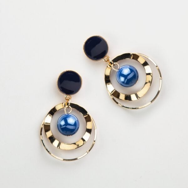 Golden round earrings with blue beads in them Golden round earrings with blue beads in them