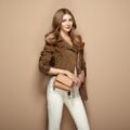 Young blond woman in brown jacket Young blond woman in brown jacket